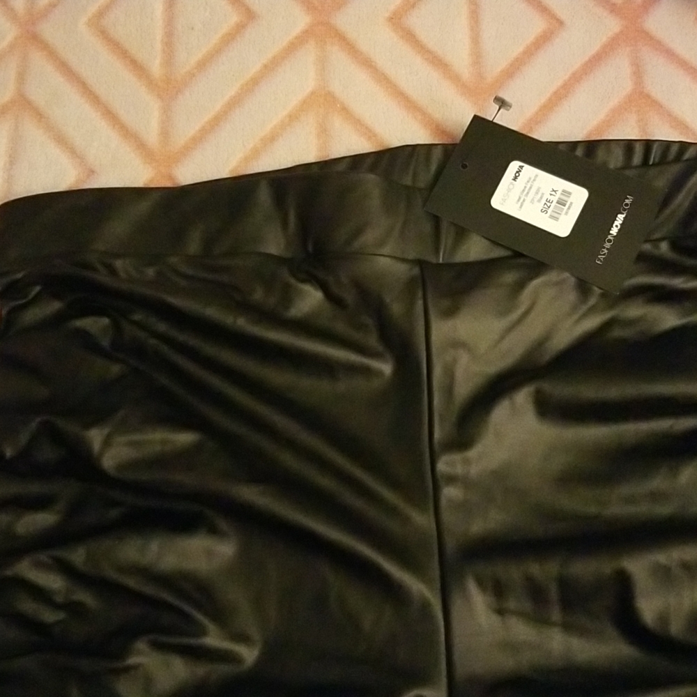 Black faux leather stacked pants